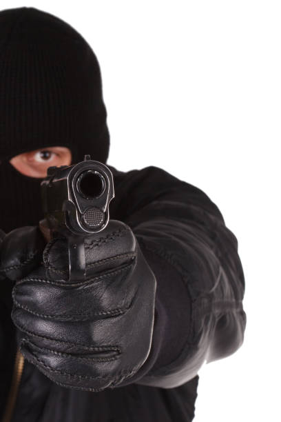 Robber with black balaclava and handgun