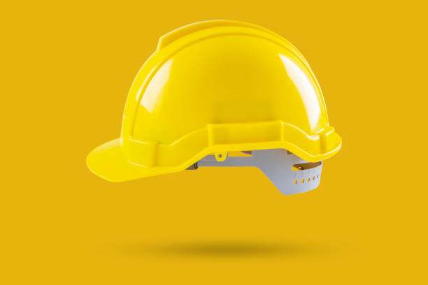 istock Safety construction helmet on yellow background 2049134737