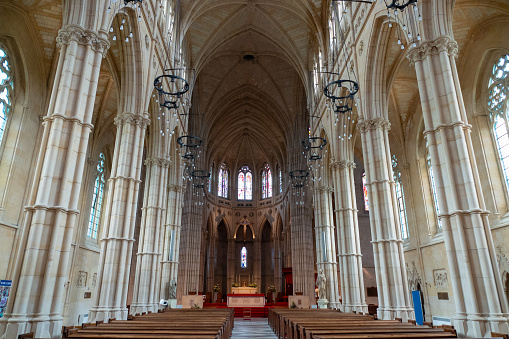 Grand interior of Arundel Cathedral, with towering columns, stained glass windows and vaulted ceilings, radiates sense of peace. Amazing architectural masterpiece of historic and religious importance.