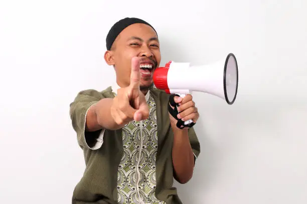 Photo of Indonesian Man Promotes Special Offer, Pointing at You