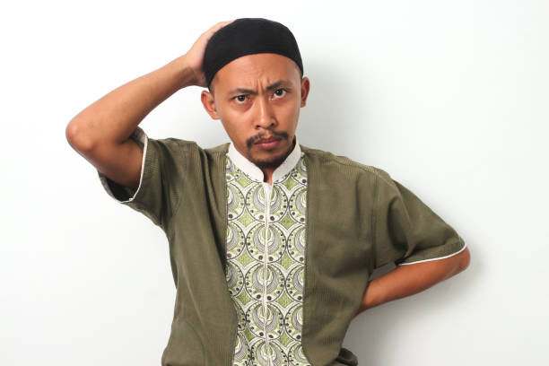 istock Anxious Indonesian Muslim Man Expresses Failure and Frustration 2049171508