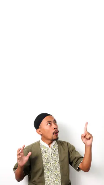 Photo of Indonesian Muslim man has an idea on a White background