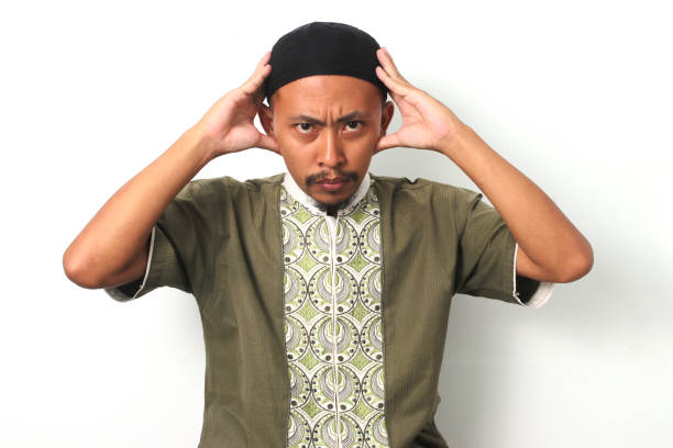 istock Anxious Indonesian Muslim Man Expresses Failure and Frustration 2049185966
