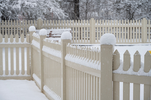 Fence covered with snow