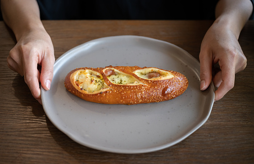 The pretzel bun, also known as Laugenbrot or Laugenbrötchen, is a type of bread roll native to Germany.
