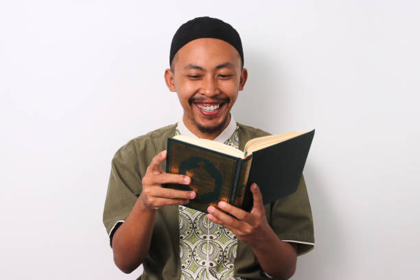 istock Indonesian Muslim Man reciting Quran 2049279412