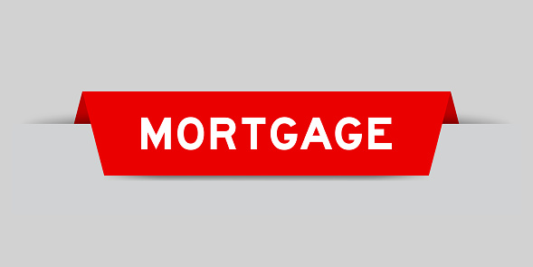 Red color inserted label with word mortgage on gray background