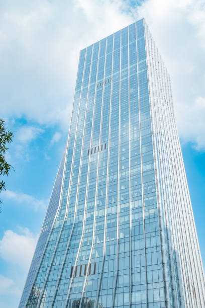 istock a commercial building in a cloudy day vertical composition 2049311598