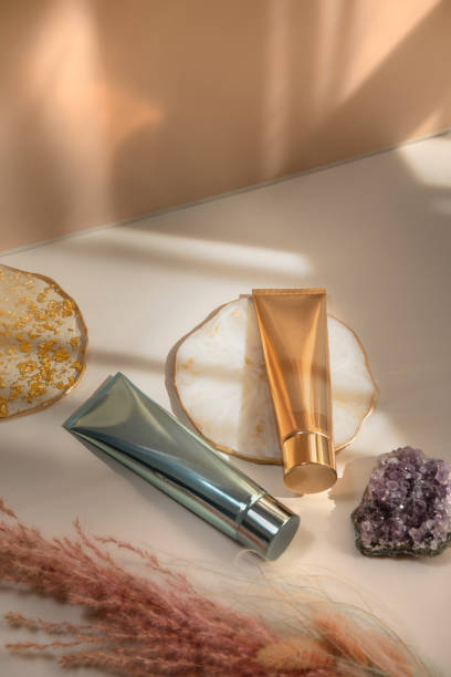 istock Beauty product still life light and shadow pastel gold 2049329510