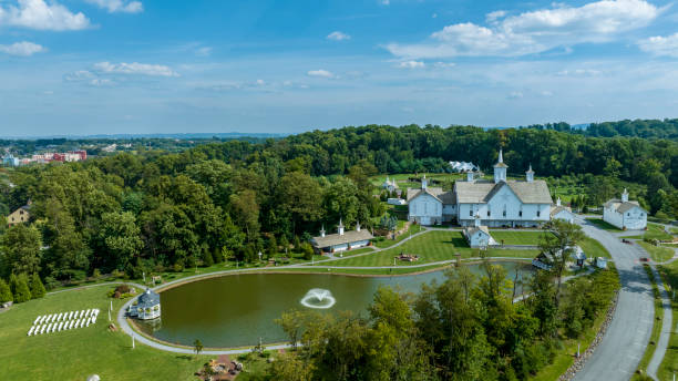 istock Aerial View Religious Complex With Multiple White Buildings Shining Golden Domes, Pond With Fountain 2049470929