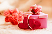 Red hearts and pink gift box. Celebration holidays. Valentines Day, Birthday, Dating, Mothers Day