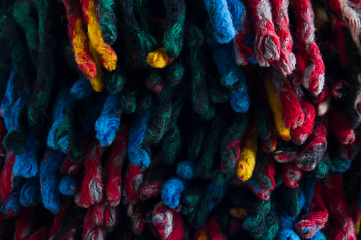Close-up taken of Colorful tassels of scotch, wool blanket background.