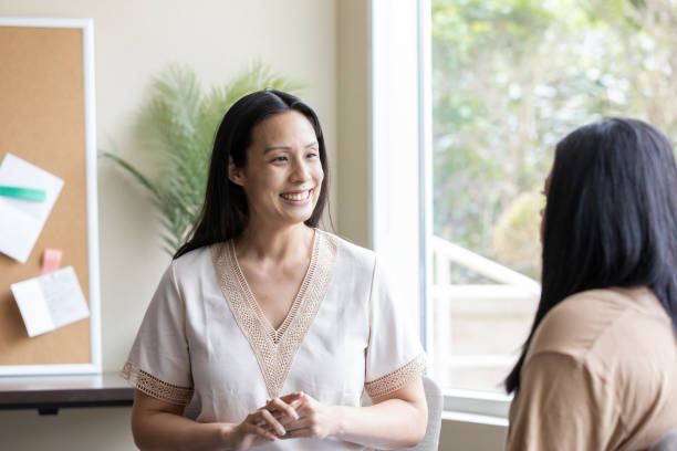 istock In a nurturing environment, adolescents engage in a support group setting with the guidance and expertise of a counselor or teacher 2049554043