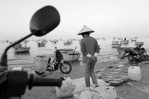 Mui Ne, Vietnam - Feburary 2, 2024: Local women trading on the beach of Mui Ne, Vietnam