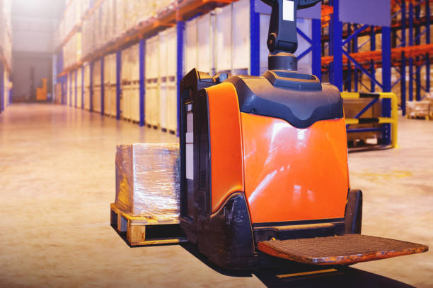 istock Electric Forklift Pallet Jack and Package Boxes on Pallet. Forklift Loader. Storage Warehouse. Supply Chain. Shelf Storehouse Supplies Distribution Warehouse Shipping. 2049563829