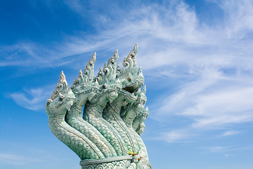 Thai dragon, king of naga statue with blue sky background.