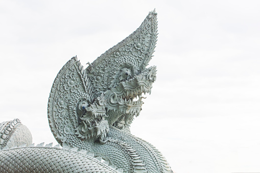 Thai dragon, King of naga statue isolated on white sky.