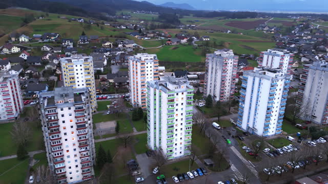 AERIAL Drone Shot of Residential Buildings Painted in Different Colors in Town, Slovenia
