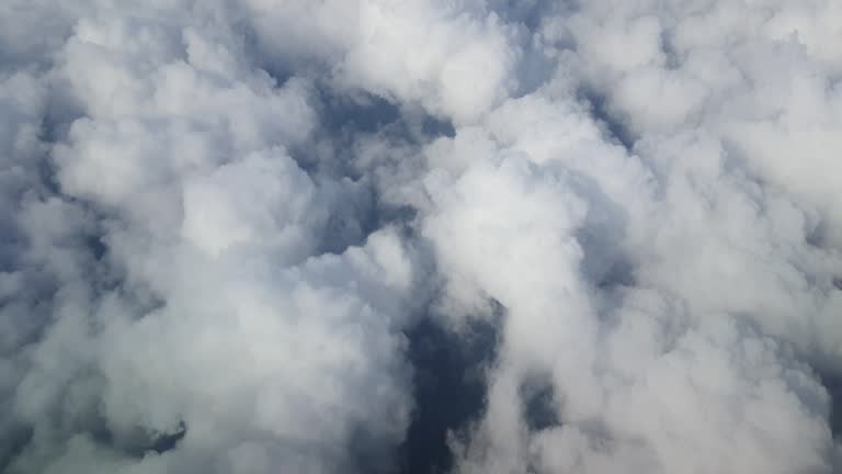 Cloud in the sky viewed from aircraft window, concept of travelling by plane.