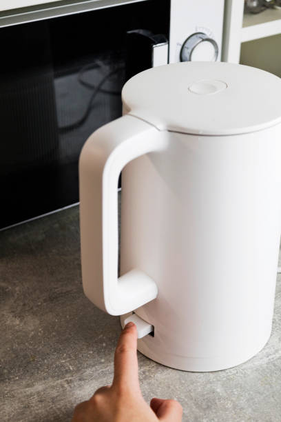 istock Includes an electric kettle for boiling water. Energy saving concept, expensive electricity 2049700737