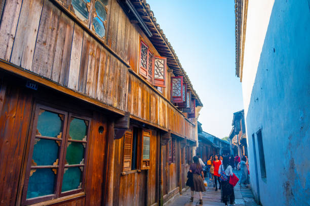 Jiaxing City, Zhejiang Province, China - November 16th 2019: Photo of Tourist Scenery of  Wuzhen  ancient town, People are visiting very ancient houses in sunny day