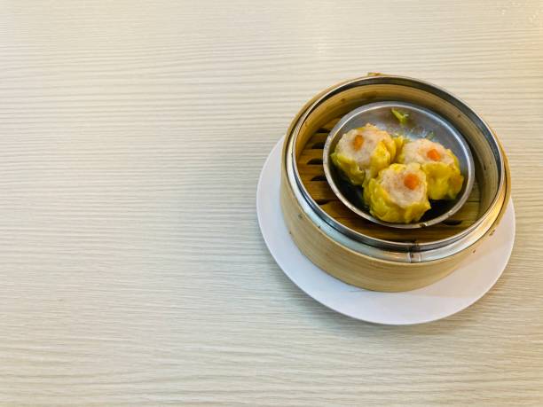 istock chinese style steamed shrimp dumplings in bamboo basket 2049799779