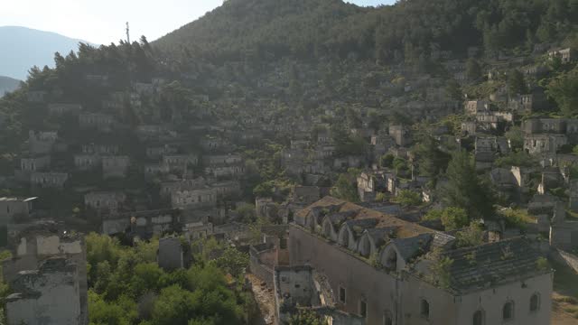 Abandoned Village of Kayakoy, aerial video, panning shot revealing the village hill