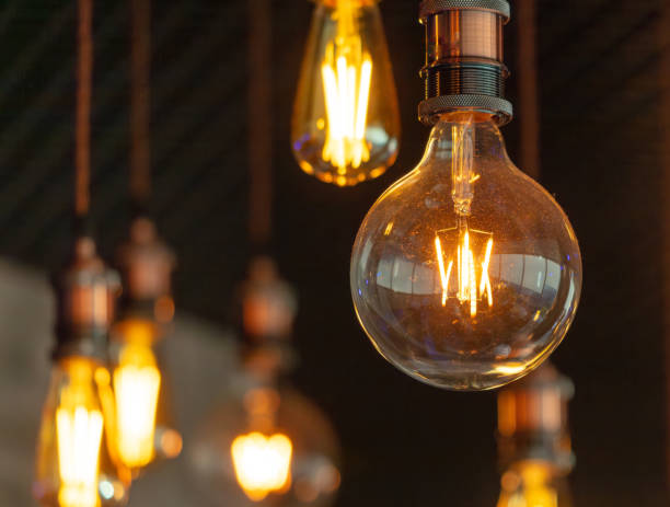 istock Decorative antique edison style filament light bulbs hanging from ceiling 2049852188