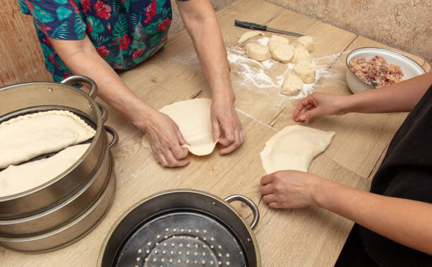 istock Hands of women kneading dough for dumplings 2049874198