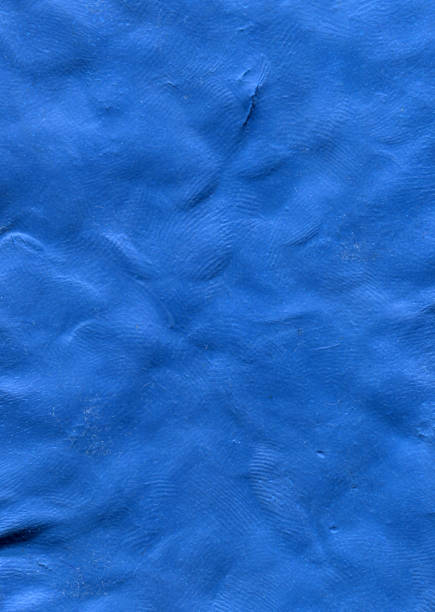 istock Ultramarine plasticine texture. Cobalt blue playdough textured background. Blue clay textures. 2049907007