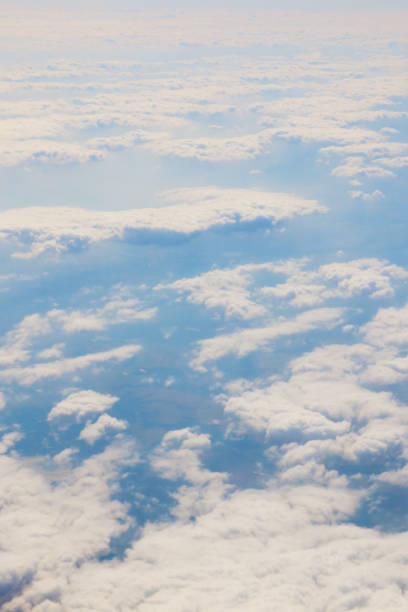 istock View of white clouds from the window of a flying plane. 2049917501
