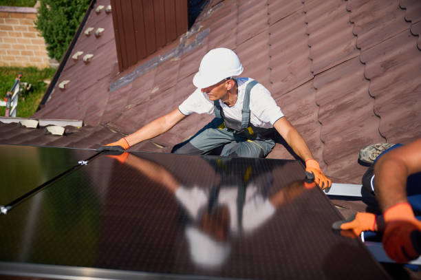 istock Workers building solar panel system on roof of house. Men installing photovoltaic solar module 2049932674