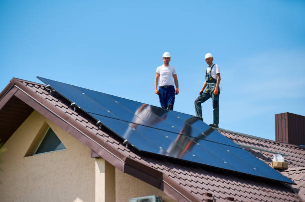 istock Workers building solar panel system on metal rooftop of house. 2049932686
