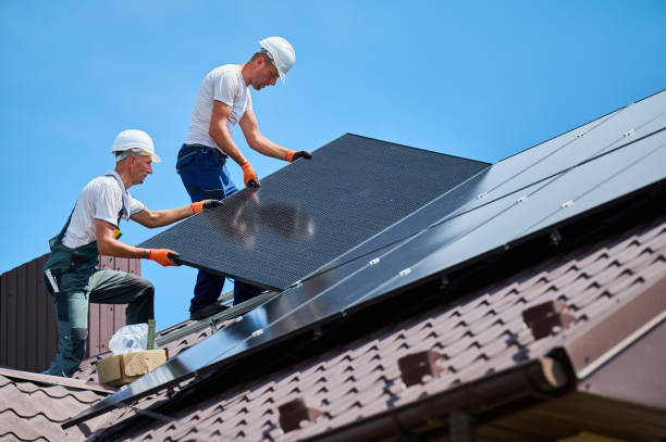 istock Workers building solar panel system on roof of house. Men installing photovoltaic solar module 2049932690