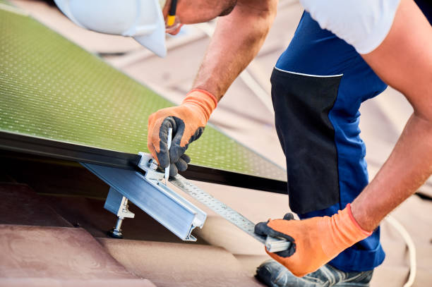 istock Worker building photovoltaic solar panel system, using ruler to measure mounting equipment. 2049933258