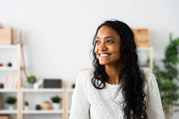 istock Positive Indian young woman thinking 2049935411