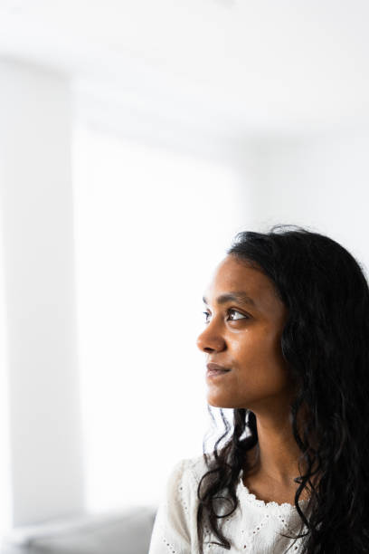 istock Indian pensive woman thinking with copy space 2049935415