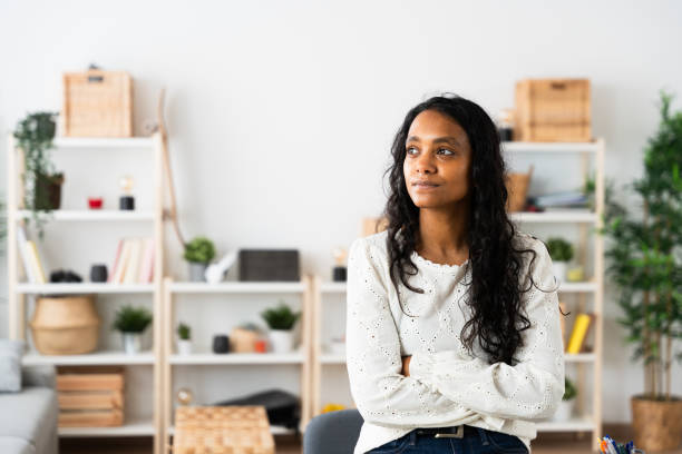 istock Serious Indian woman thinking at home 2049935419