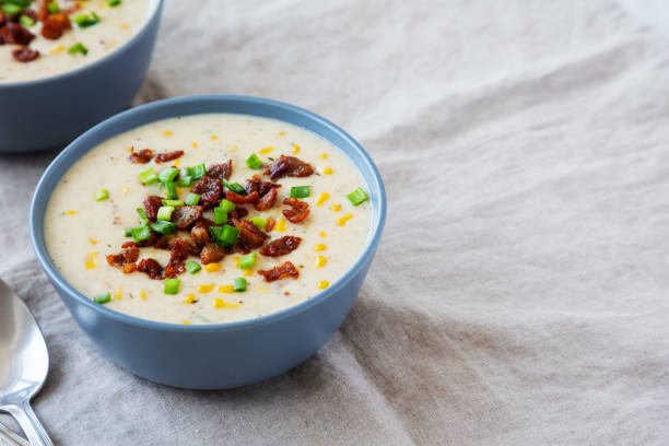 istock Homemade Corn Chowder with Bacon in Bowls, side view. Space for text. 2049942888