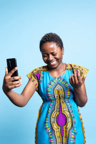 istock Joyful ethnic person waving on videocall network over blue background 2049945635