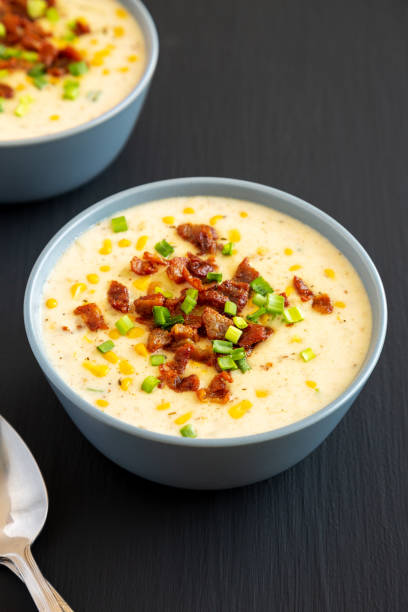 istock Homemade Corn Chowder with Bacon in a Bowl on a black background, side view. 2049948246