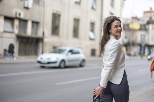 istock Happy woman in city walk 2049982126