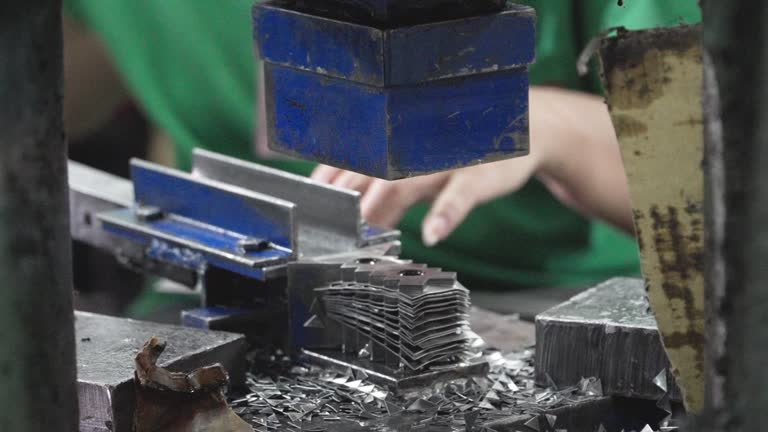 factory concept,Closeup of worker's hands working Metal Forming Process factory