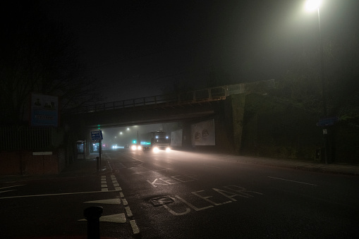 A truck in the fog at night in north London.