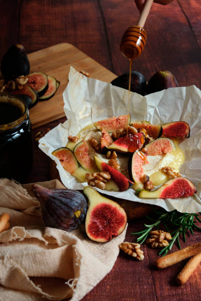 istock figs camembert cheese and honey 2050056640