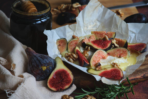 istock figs camembert cheese and honey 2050059320