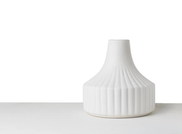 Empty ceramic vase on painted wooden table isolated on white