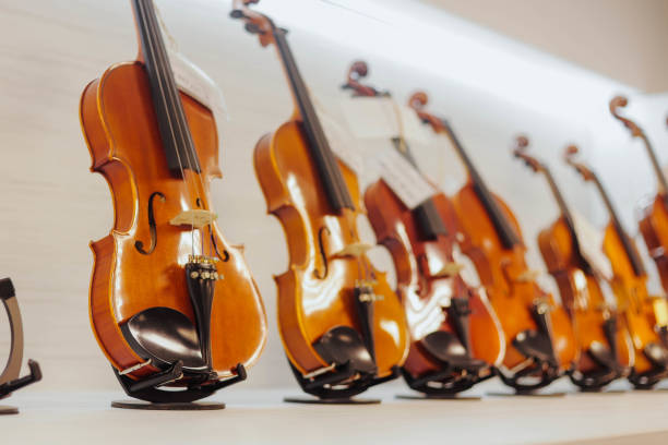 istock Violins on shelve at music store. Close up. 2050079016