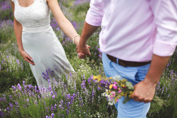 istock Bride and groom walking together holding their hands 2050080008