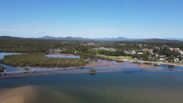 Urunga boardwalk aerial views inland past Urunga town and up the river valleys to the Great Dividing Range
